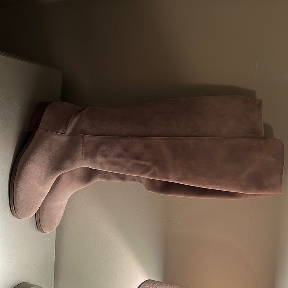 Tan leather riding boots.